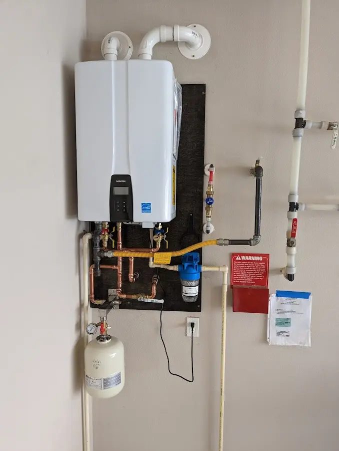 Professional plumber installing copper piping in a Peach Bottom home